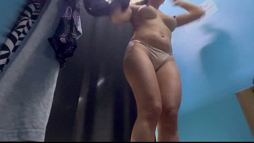 Sexy MILF with big ass changing clothes in a public place 