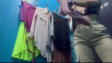 Sexy milf changes clothes in a public locker room