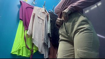 Sexy milf changes clothes in a public locker room 