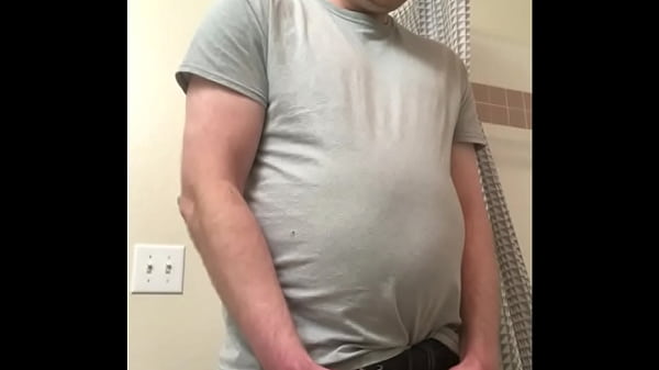 Guy enjoys taking a nice piss in his bathroom 