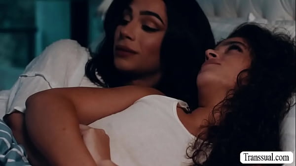 Big tits TS Ariel Demure and her stepsister Victoria Voxxx are on the bed kissing each other 