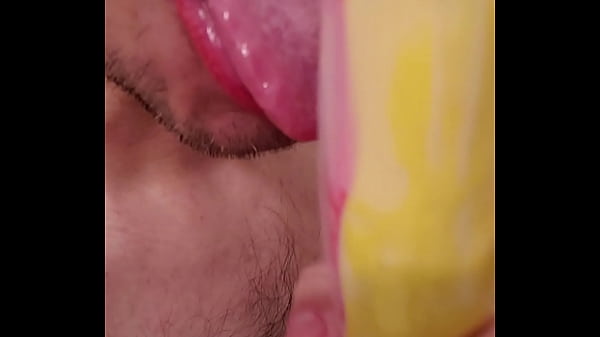 Fellatio practice with penis shaped sex toy 