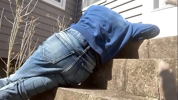 Mayofascial stretch of leg and side on cement steps 