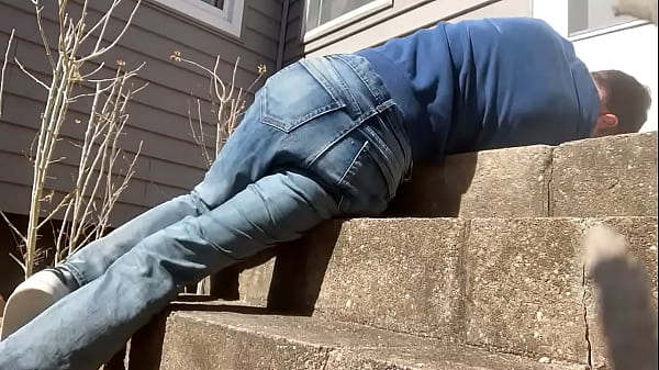 Mayofascial stretch of leg and side on cement steps 