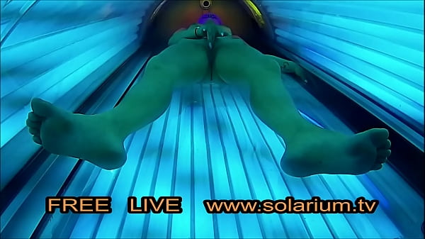 Beautiful girl withnice big breasts masturbates under the www.solarium.tv