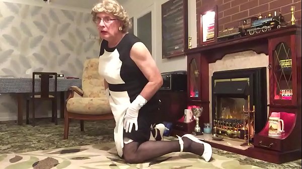 Crossdresser Johanna Clayton dressed in black & white dress, for all to view. Legs, Heels etc 