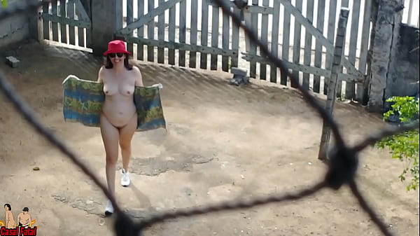 My Wife Goes Outdoor Wearing Shoes, A Towel And A Hat. She Walks Naked Outside. thumbnail