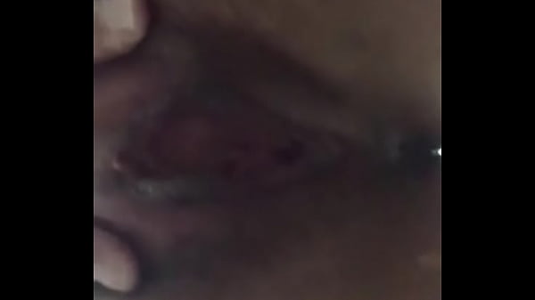 Showing her wet pussy