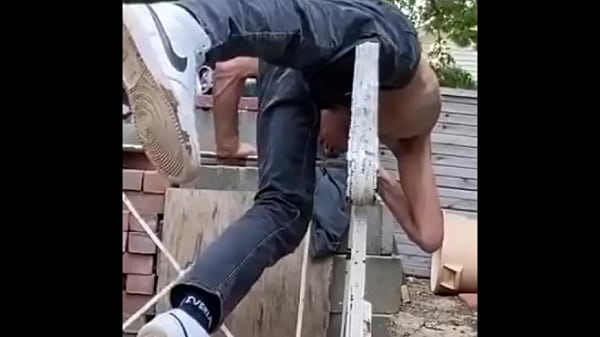 Stretchingand Twisting onwroughtiron railing injust jeans for_Pain Relief