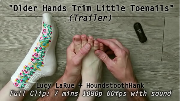 Older hands trim little toenails 