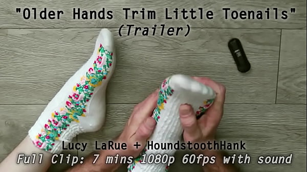 Older hands trim little toenails