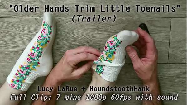 Older hands trim little toenails 