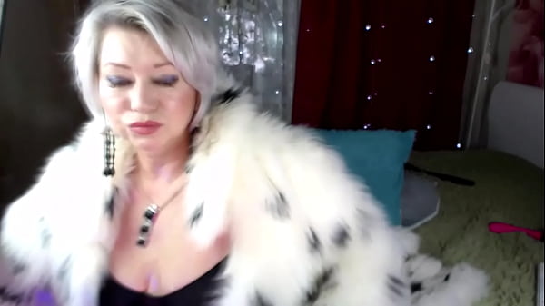 Sex performance of a mature bitch in a beautiful fur coat 