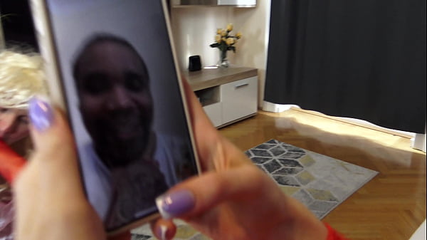 Sitting on the bed, Roxana lets her Sissy Cuckold Foot Bitch lick her red-stockinged feet 