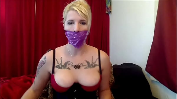 Blonde Woman Has Mouth Muzzled To Demonstrate How Movie Damsels Should Be Gagged! thumbnail