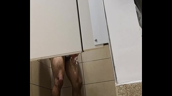 Man wanking after workout in gym 