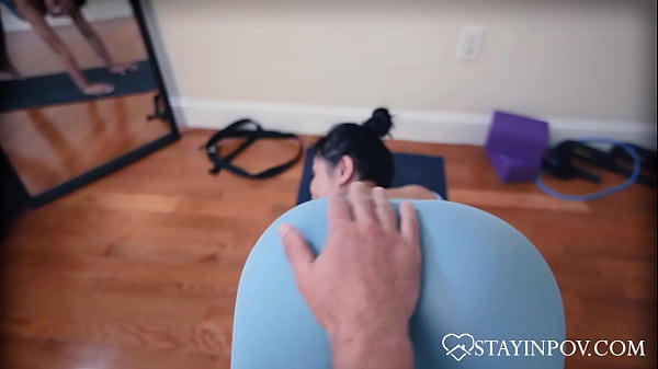 Asian Yogi Stretches At Home 