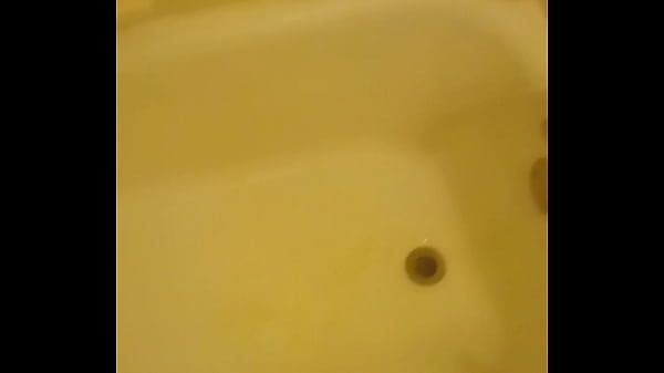 Urinating unto the bathtub 
