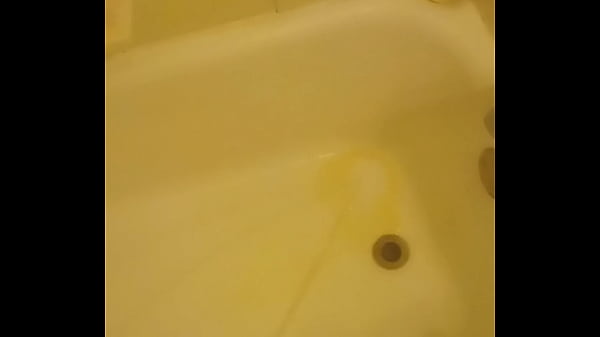 Urinating unto the bathtub 