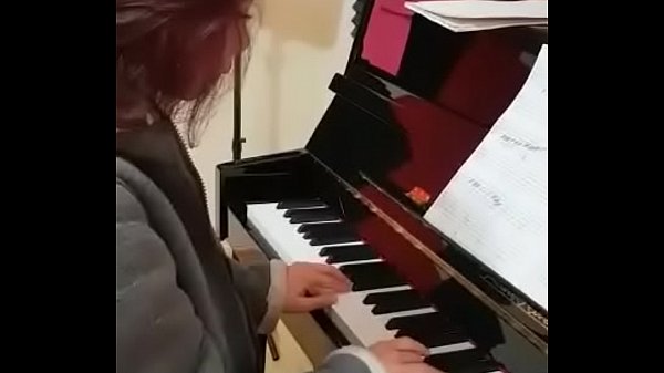 Full dressed playing the piano 
