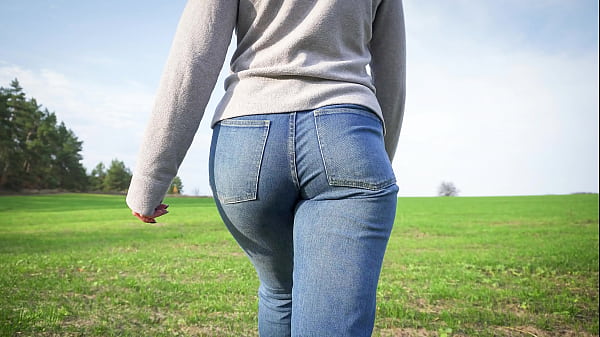 Girl Walks Outdoor In Denim Pants 4k thumbnail