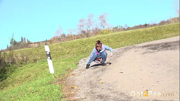Got2pee Brings Another Desperately Peeing Girl In Field Desperation - Featuring Big Puddle thumbnail