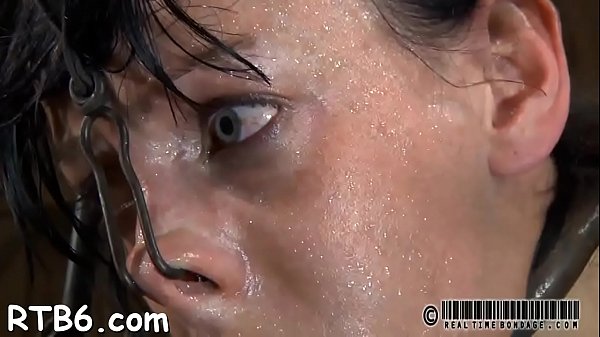 Tied up bondman receives tight maskwith hardtoy in her cunt