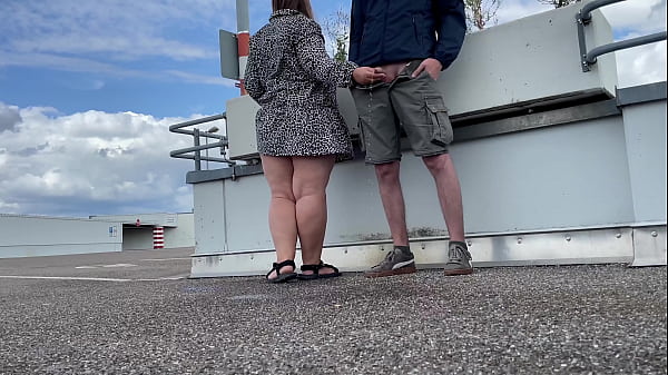 Play MP4 - MILF spreads her legs wide and bends over to pee in the parking lot
