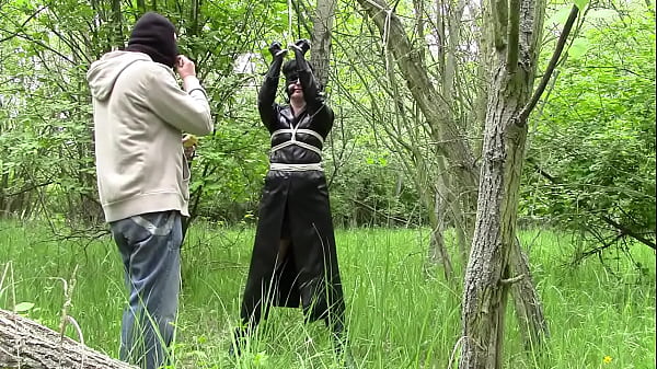 Wife In Leather Coat Tied Up In Forest thumbnail