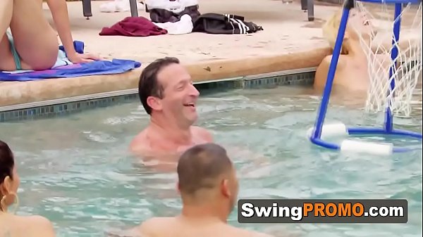 Hot brunette is_having her pussy licked at a wild swinger_pool party.