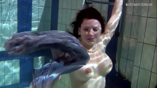 Swimming babe Katka strips down in the swimming pool 