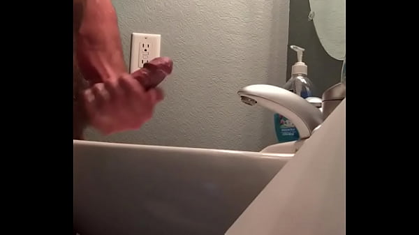 Hung man jerking off fat cock with cumshot. 