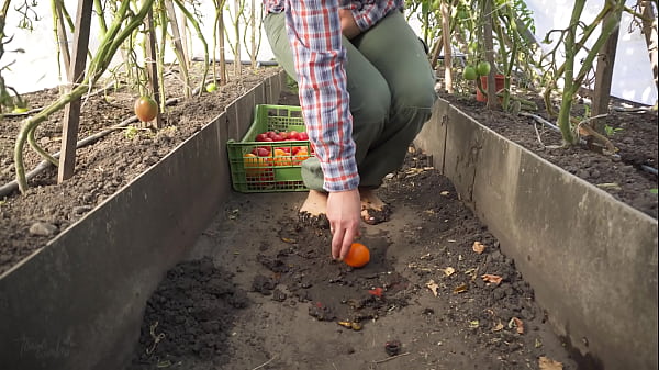Dirty feet crushing vegetables outdoors