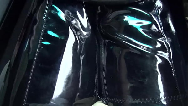 Bella in Crotchhigh boots driving a sportscar 