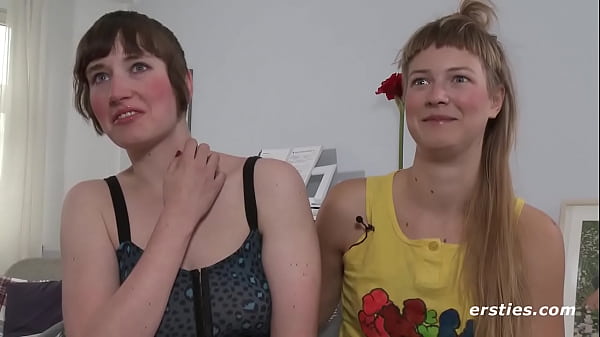 Lesbian friends play with a sex toy