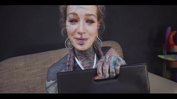 Tattoo slut sinks a thick metal toy deep into her hole 