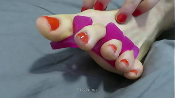 Red toenail polish application