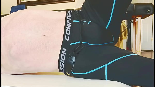 Stop Action Stretching on Table in Compression Tights and Groin Brace 