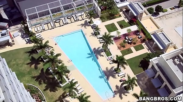 Cute girl in glasses by the pool picked up 