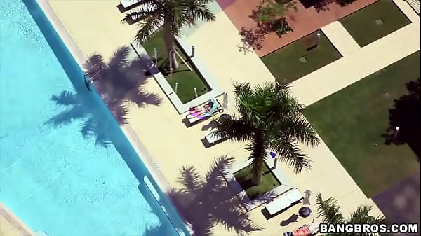 Cute girl in glasses by the pool picked up