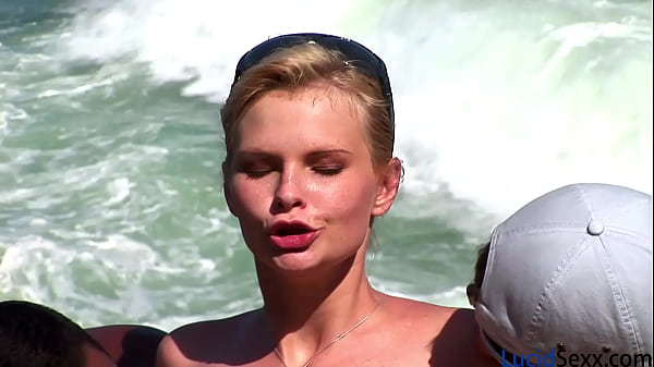 Beach slut with nice boobs gets DP'ed by two guys and takes cum down her throat and on her tits 