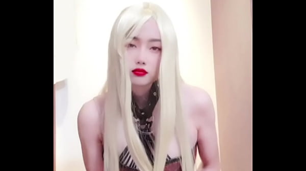 Shemale wears fishnet stockings to reach orgasm and ends up ejaculating on her own legs 