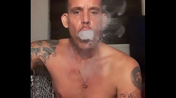 Tall Handsome Man Models In Font Of Camera While Smoking And Playing With His Cock thumbnail