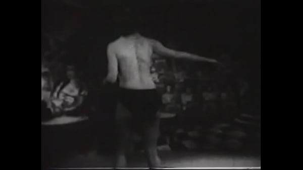 Busty lady in a circus costume erotically dances in an old movie 