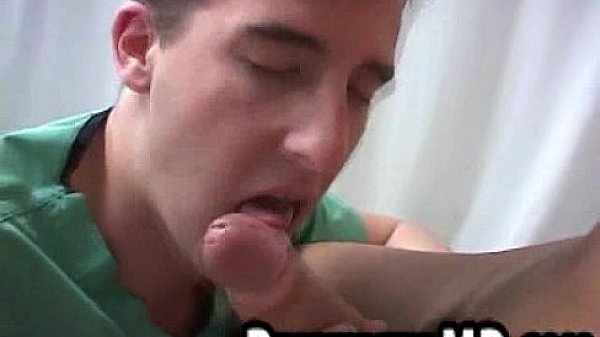 Two hot hunks are giving head to eachother in the doctors office 