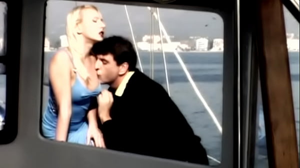 On the boat out at sea gina has sex with a man wearing a suit 