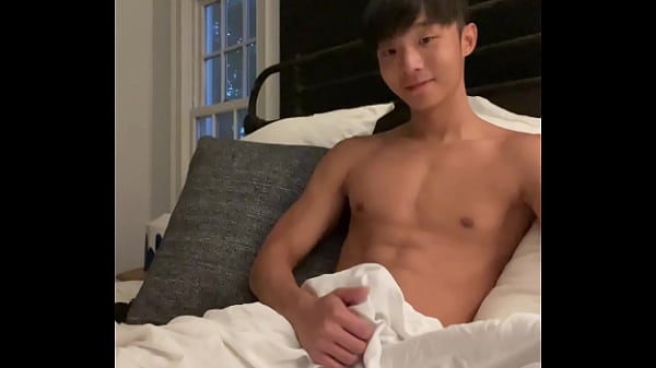 Asian boy stroking cock 