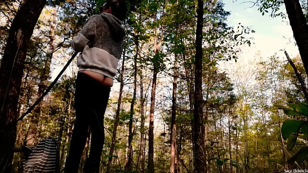 Outdoors sage eldritch taking down her hammock 