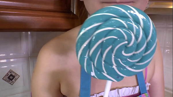 Play MP4 - Brunette sucks on a lollipop in high heels