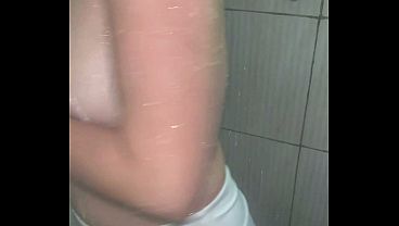 Wetlook. Shower in a top and shorts
